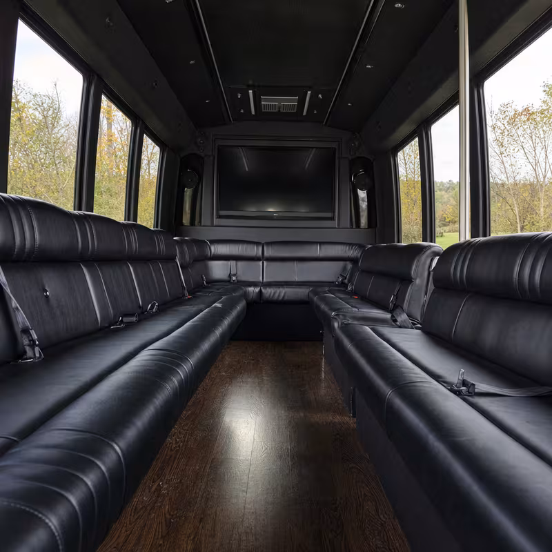 Friends laughing during a Goodyear party bus celebration