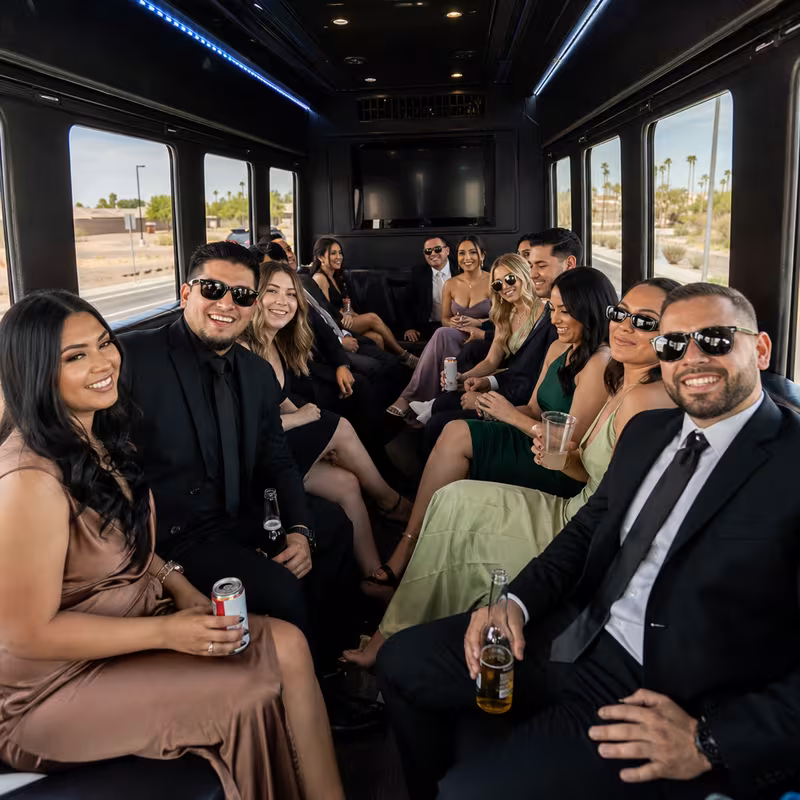 Wedding guests seated inside a Goodyear party bus