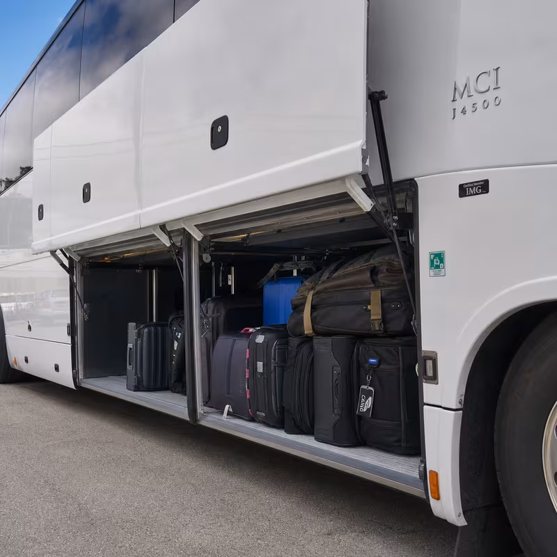 Party bus interior with wraparound leather seating and LED lighting in Goodyear