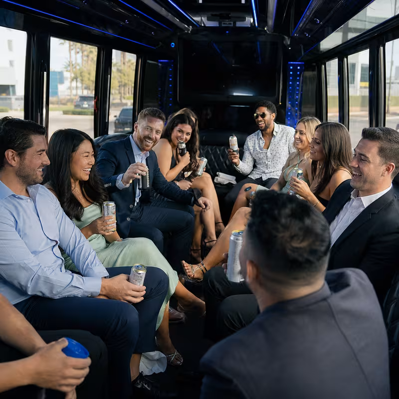 Party bus interior with wraparound leather seating and LED lighting in Goodyear