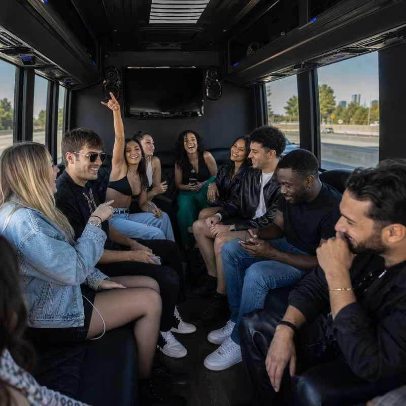 Group boarding a white charter bus for Concert Transportation transportation in Goodyear