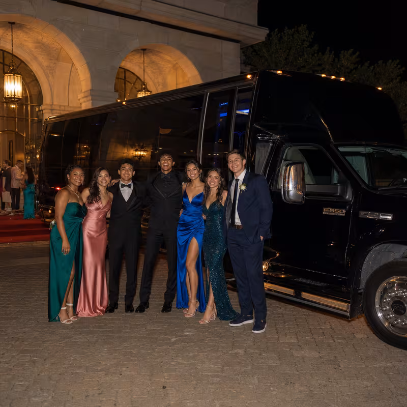 Party bus interior with wraparound leather seating and LED lighting in Goodyear