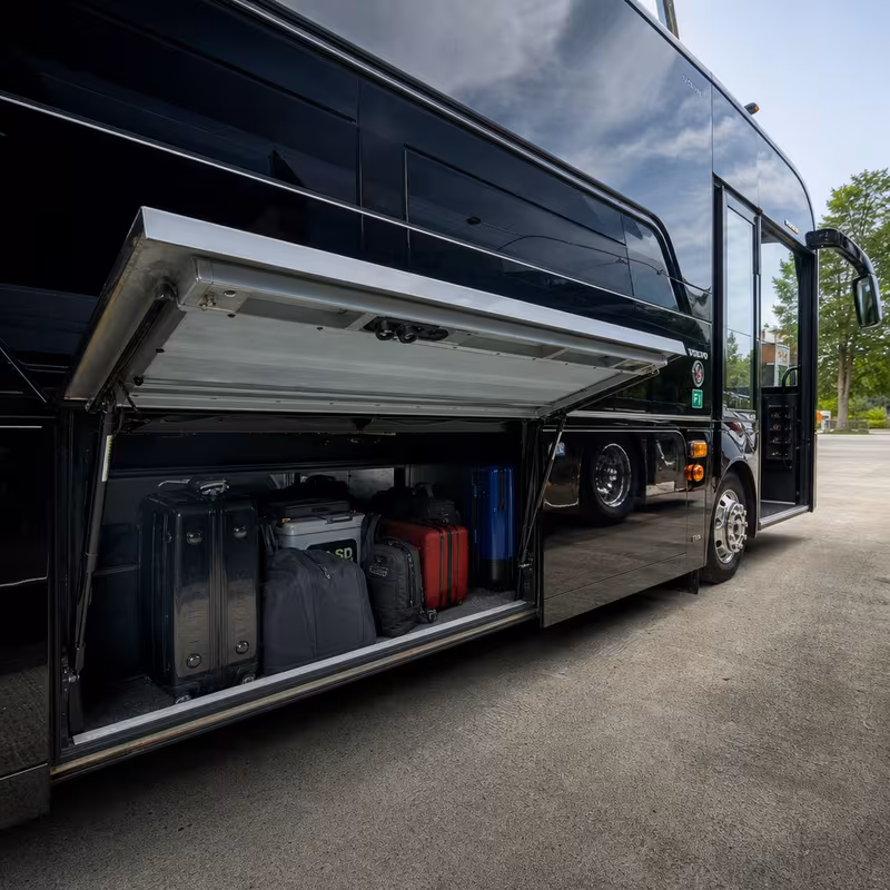 Party bus interior with wraparound leather seating and LED lighting in Goodyear