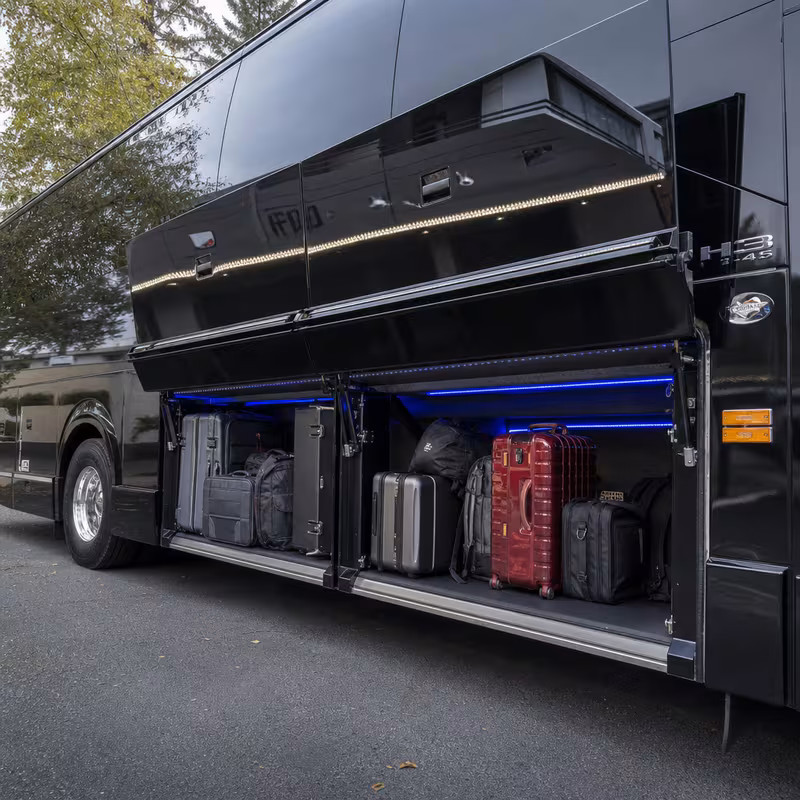 Party bus interior with wraparound leather seating and LED lighting in Goodyear