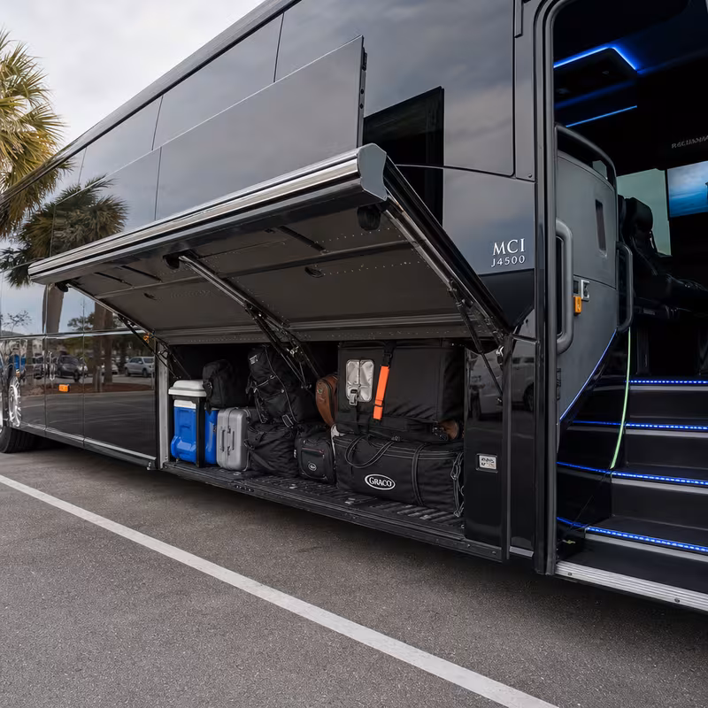 Party bus interior with wraparound leather seating and LED lighting in Goodyear
