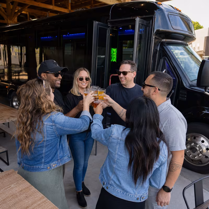 Passengers loading luggage while boarding an Goodyear group shuttle